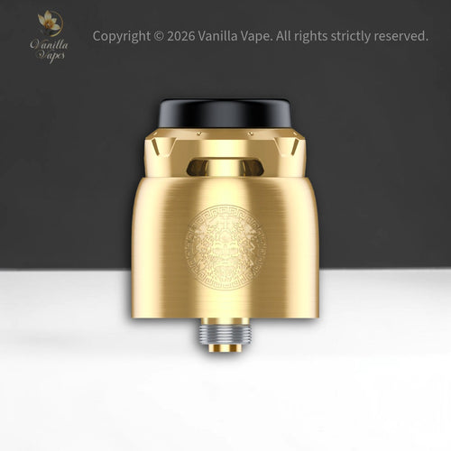 Gold vape device with black top on a white and gray gradient background, Vanilla Vape brand visible.